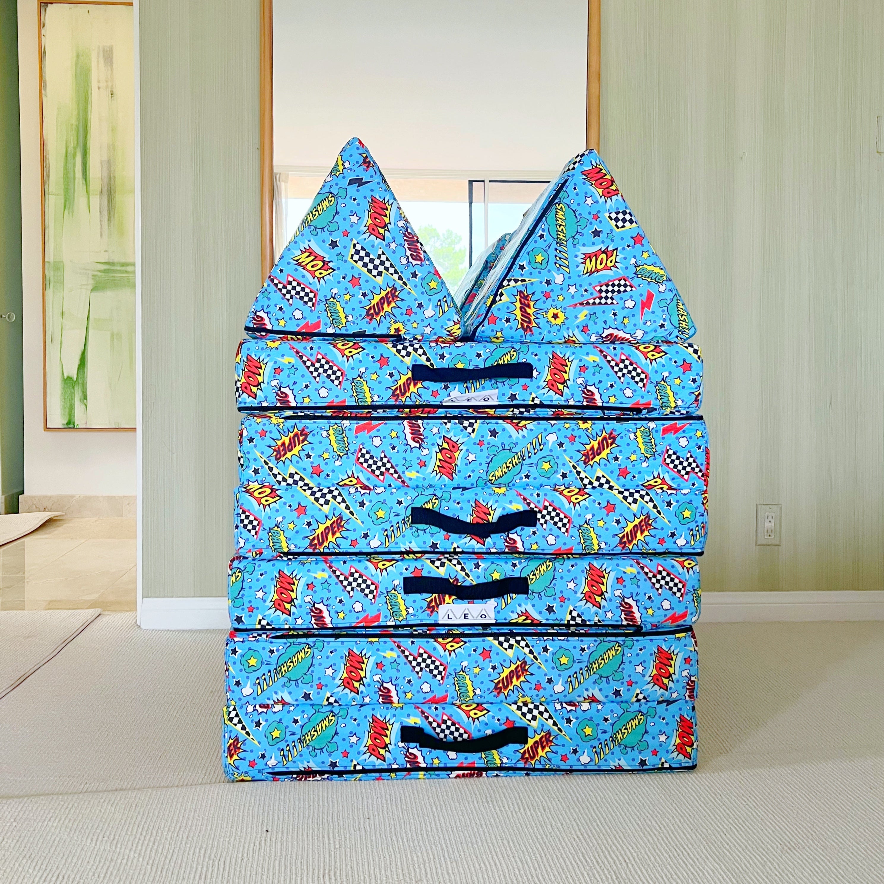 Play Couch stack with cartoon designs on a light-colored floor.