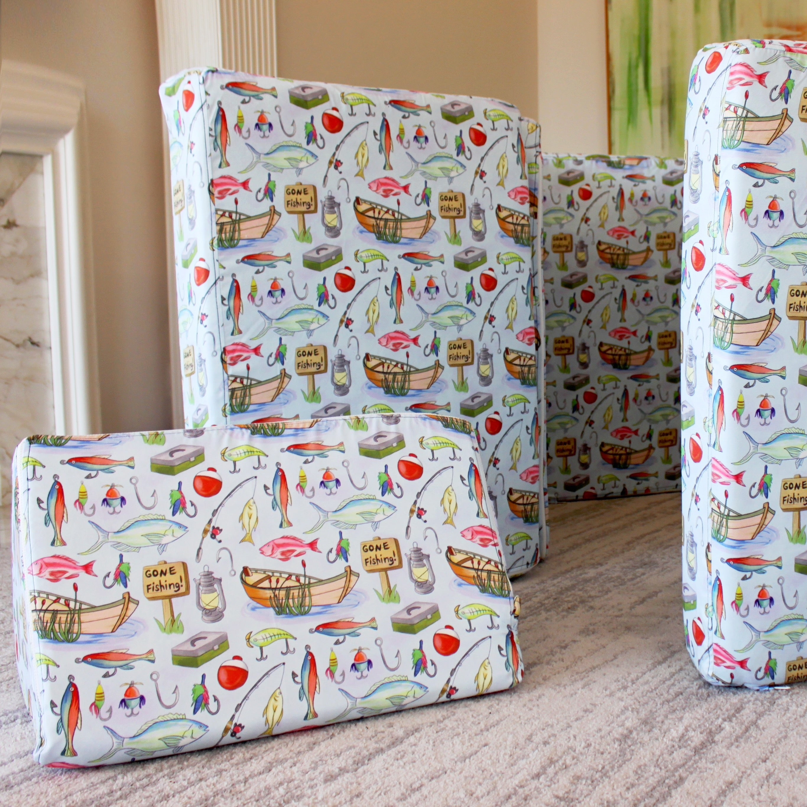 Patterned fabric panels with boat and fish design on a neutral background