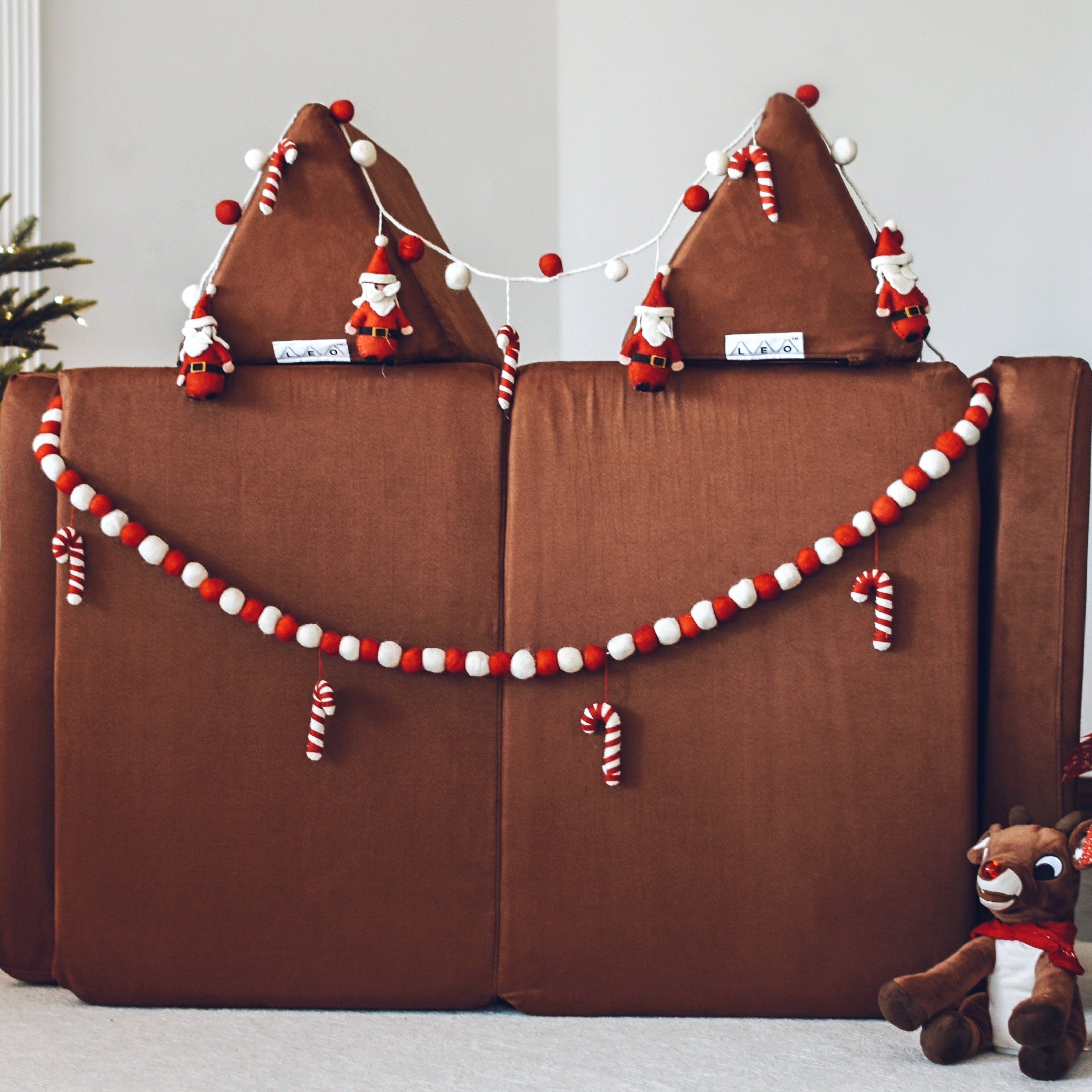 Decorated brown kids play couch in a living room setting.